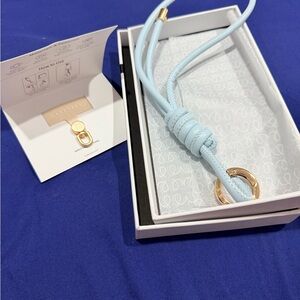 Casecess Light Blue Leather phone wristlet with Gold Accents